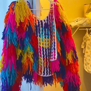 Multi color jacket with fringes .